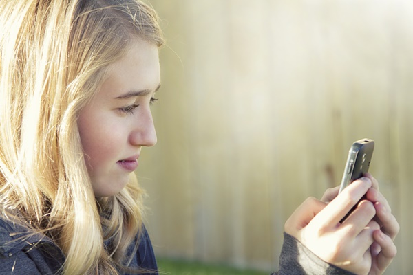 Teenage girl using a cell phone